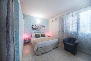 Postel nebo postele na pokoji v ubytování Albergo Luisss