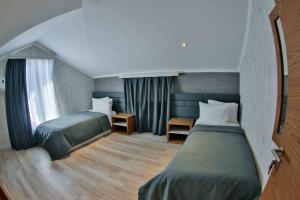 Yurd Hotel客房内的一张或多张床位