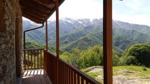 a room with a balcony with a view of mountains at Rifugio Alpino Baudinet - Trek&Relax in Chiusa di Pesio