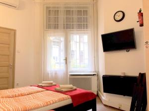 A television and/or entertainment centre at Basilica Suites