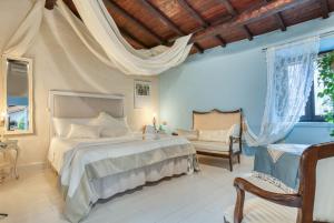 Postel nebo postele na pokoji v ubytování B&B dei Papi Boutique Hotel