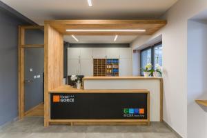 a view of the front of a office with a desk at Hotel***Gorce in Nowy Targ