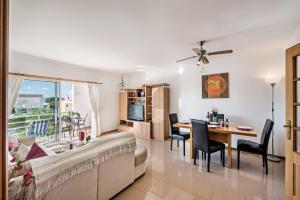a living room with a couch and a table at Apartment Galé Garden 1A in Albufeira