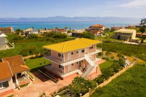 an aerial view of a house with a yellow roof at Botzoris Apartments in Sidari