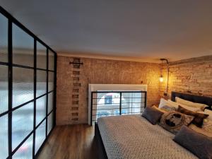 Posteľ alebo postele v izbe v ubytovaní The Address Loft 22ppl