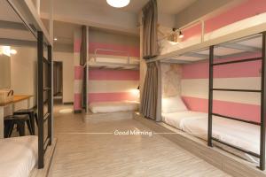 Postel nebo postele na pokoji v ubytování Bayhouse Comfortel Hualien Hostel