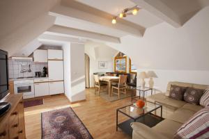 a living room with a couch and a table at Appartementhaus Erasim in Schladming