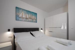 Postel nebo postele na pokoji v ubytování Apartments 20 meters from the beach