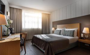 Ein Bett oder Betten in einem Zimmer der Unterkunft Mercure Lisboa Almada
