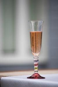 a glass of wine sitting on top of a table at BREVOCEAN Chb calme Côte Atlantique in Saint-Brévin-lʼOcéan