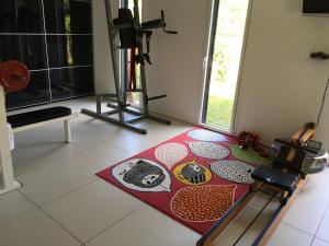 a living room with a red rug on the floor at Villa NOVA in Saint-Hilaire-de-Riez