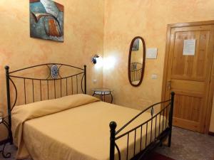 Postel nebo postele na pokoji v ubytování Palazzo Aprile