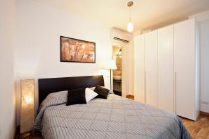 A bed or beds in a room at Romacentrarte