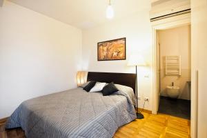 A bed or beds in a room at Romacentrarte