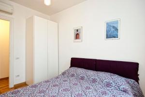 A bed or beds in a room at Romacentrarte