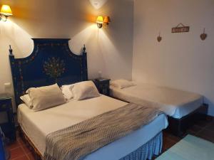 
A bed or beds in a room at Hotel Mar e Sol VNMF by Portugalferias
