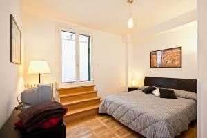 A bed or beds in a room at Romacentrarte