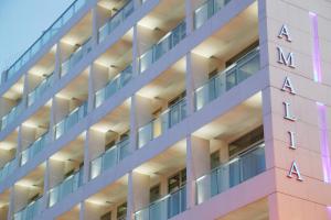 a facade of a building with theania sign on it at Amalia Hotel Athens in Athens