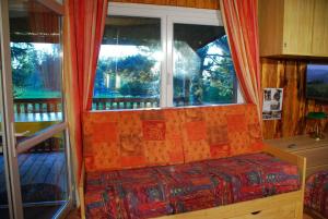 Posezení v ubytování Chalets des Trois Hêtres