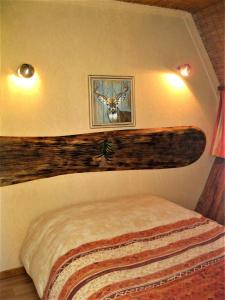 Postel nebo postele na pokoji v ubytování Chalets des Trois Hêtres