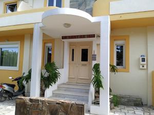 a building with a sign that reads private villa at La Santre Villa in Amoudara Herakliou
