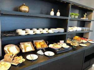 a buffet with many different types of food on display at HOTEL ROYAL AMAMBAI in Amambaí