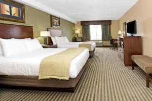 A bed or beds in a room at Days Inn by Wyndham Cheyenne