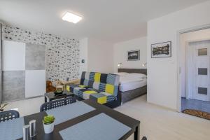 Posteľ alebo postele v izbe v ubytovaní Apartmány Malen