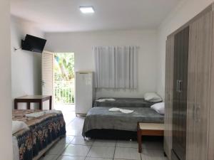 Un pat sau paturi într-o cameră la HOTEL ALAMEDA