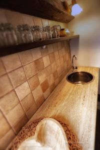 a counter top with a sink in a kitchen at Old town house in Pag