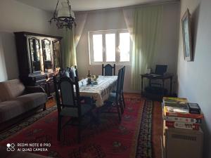 a living room with a table and a couch at Poborska Villa in Ulcinj