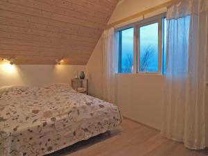 Postel nebo postele na pokoji v ubytování Skyrhusid HI Hostel