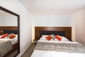 Letto o letti in una camera di Residence Hluboká