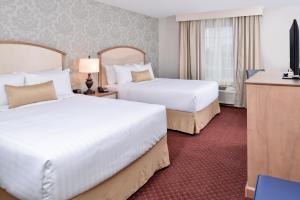 Postel nebo postele na pokoji v ubytování Appomattox Inn and Suites + 23 fotografií