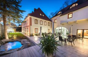 an estate with a swimming pool and a house at Residence Hluboká in Hluboká nad Vltavou