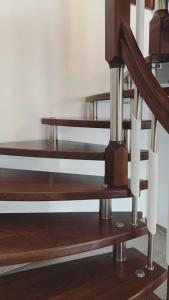 a set of wooden shelves in a room at Stadtvilla Lingen in Lingen