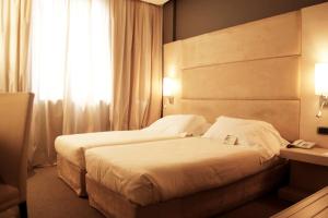 Postel nebo postele na pokoji v ubytování Best Western Plus Hotel Expo