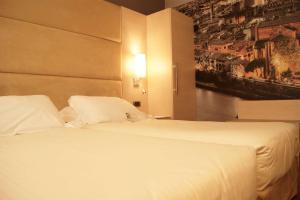 Postel nebo postele na pokoji v ubytování Best Western Plus Hotel Expo