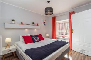 Łóżko lub łóżka w pokoju w obiekcie Goma Rent Długa Old Town Gdańsk