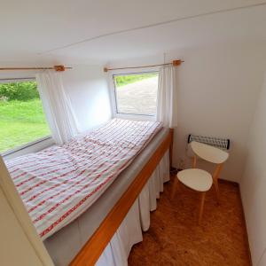 Postel nebo postele na pokoji v ubytování Ferienwohnung mit Tiny House