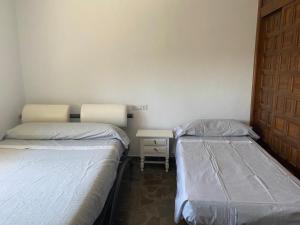 Postel nebo postele na pokoji v ubytování CASA PACA PEREA