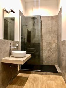 a bathroom with a sink and a shower at VdP Luxury Tuscan Villa in San Baronto