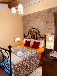 A bed or beds in a room at Casa Emma Fiattone in Garfagnana