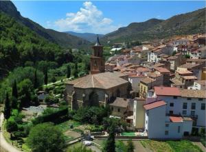 an aerial view of a small town with a church at Apartamento Las Huellas in Arnedillo