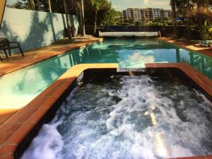The swimming pool at or near Coral Sea Penthouse Ocean Boulevard