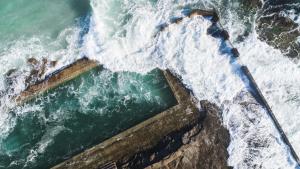 an aerial view of the ocean with waves at The Carmel Yamba in Yamba +39 photos