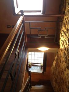 a stairway with a window and a stair case at Bed And Breakfast Mblò in Fondi