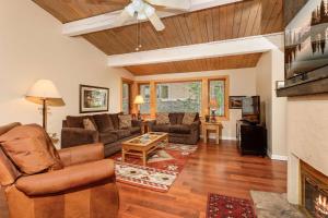 a living room with a couch and a fireplace at Aspenwood 2 bedroom K-17 in Snowmass Village