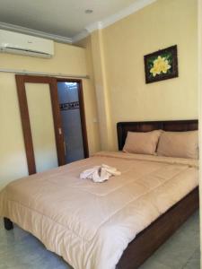 Кровать или кровати в номере Arjun Bed and Breakfast