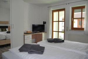 Postel nebo postele na pokoji v ubytování PAGA Hotel